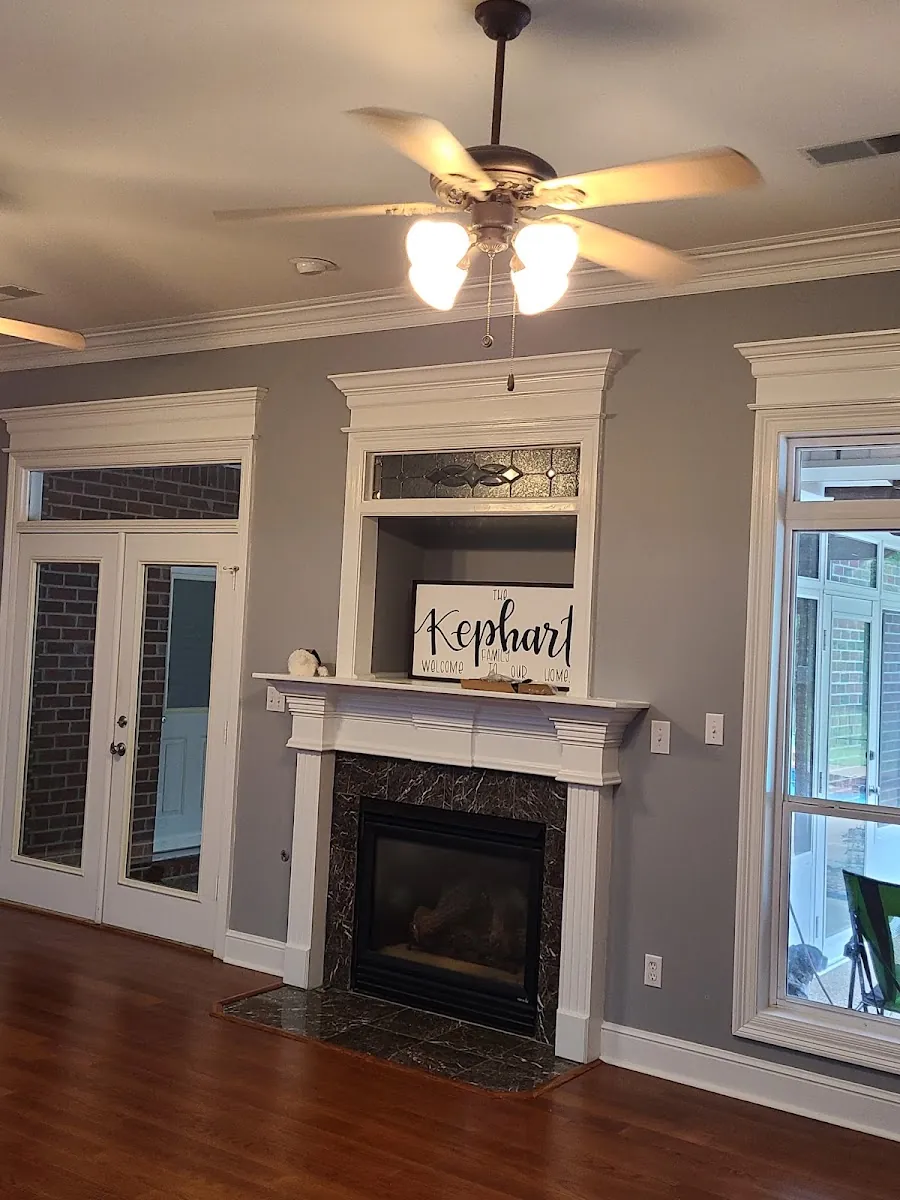 Living room remodel with custom fireplace mantel, crown molding and refinished hardwood floors