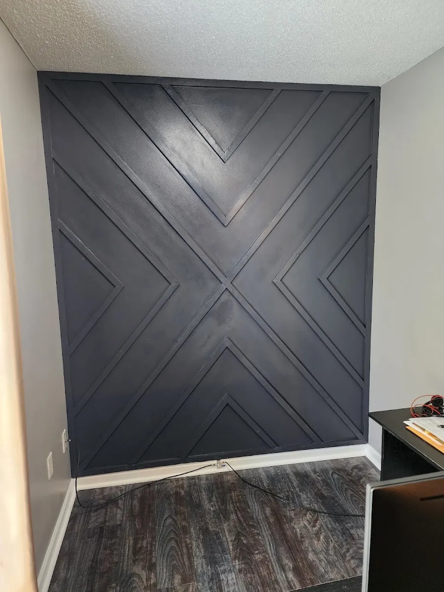 Custom stained shiplap feature wall with an X pattern accent
