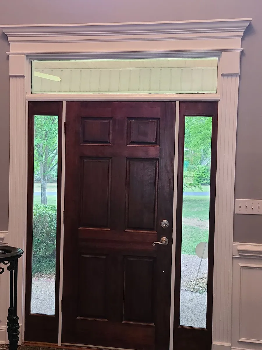 New stained front door with sidelights and custom interior trim