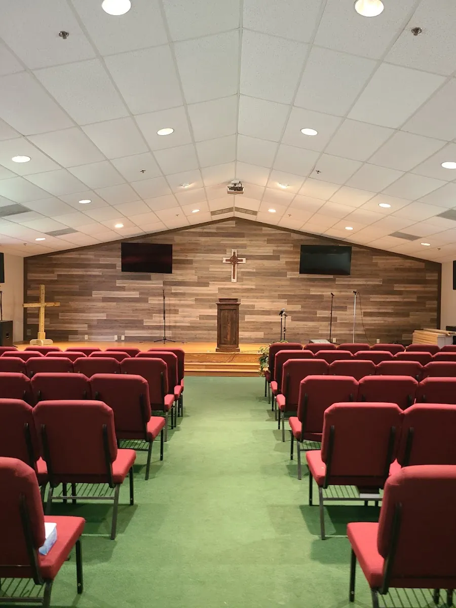 Commercial sanctuary remodel with stained wood accent wall and new flooring