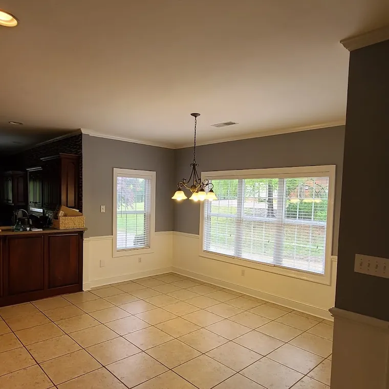 Tile flooring in an open kitchen and dining area after a remodel