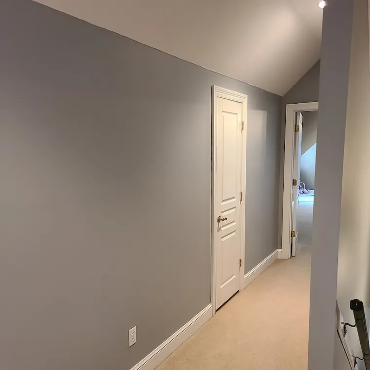 Hallway painted in a warm neutral with new trim and doors