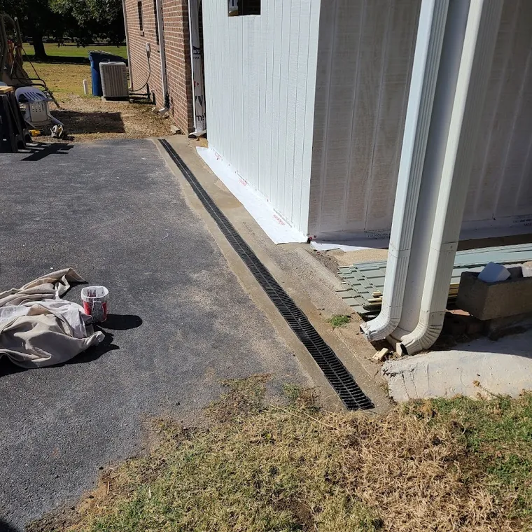 Exterior trench work for a water line running across a residential yard